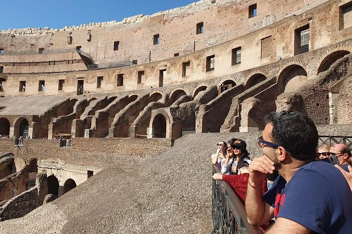 Visitors looking across the Colosseum’s upper level