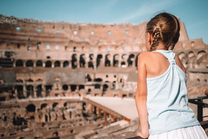 A child looking over the Colosseum interior