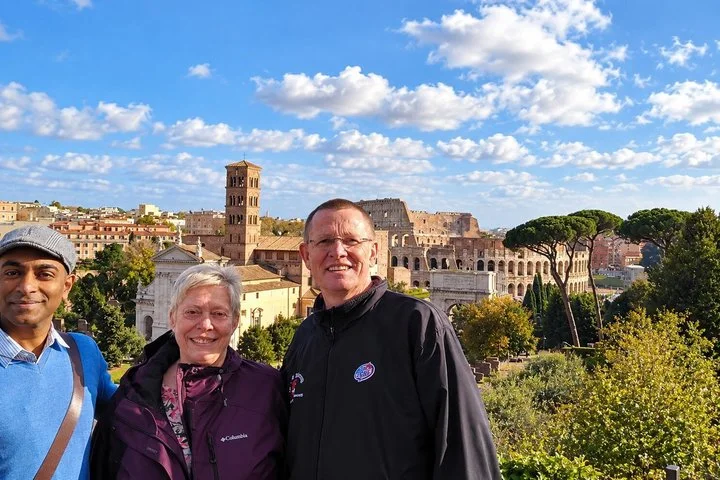 Visitors with the Forum and Colosseum behind them