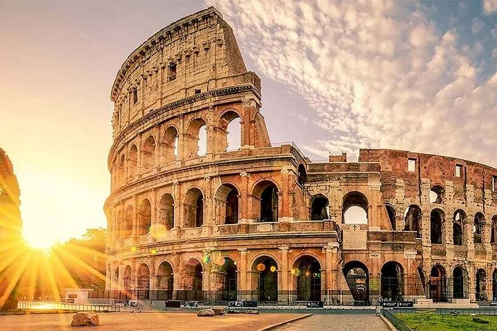 Warm sunlight beside the Colosseum exterior