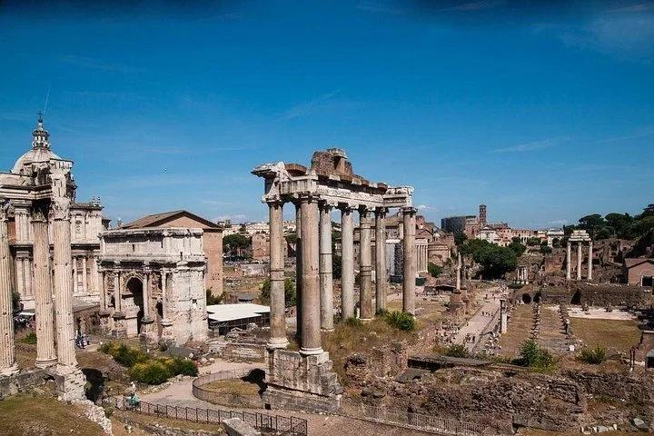 Roman Forum temples beneath a blue sky