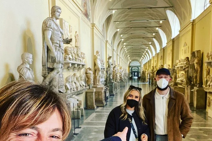 Visitors among sculpture displays in the Vatican Museums