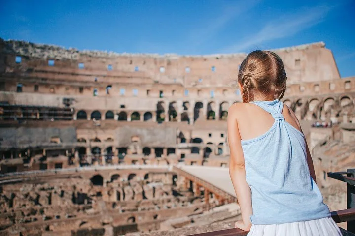 A child looking across the Colosseum interior