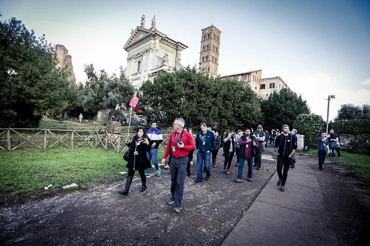 A guided group walking through the Roman Forum