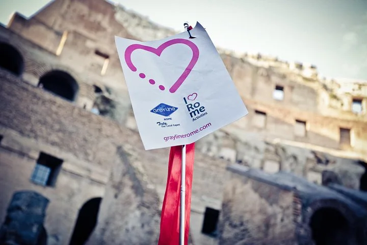 A tour flag in front of the Colosseum interior
