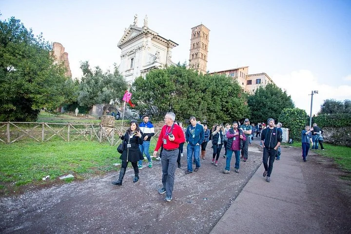 A guide leading visitors through the Roman Forum