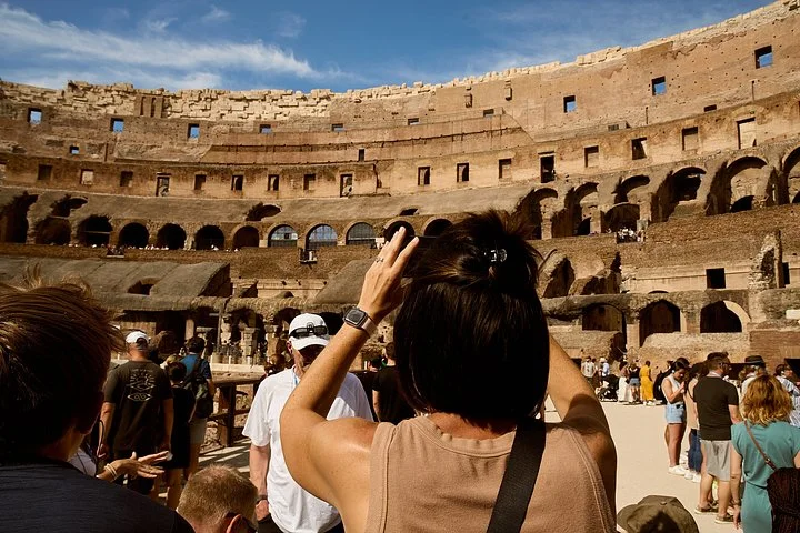Visitors stepping onto the Colosseum arena floor
