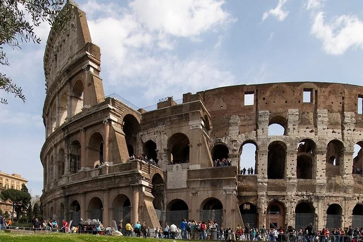 The Colosseum exterior above a green lawn