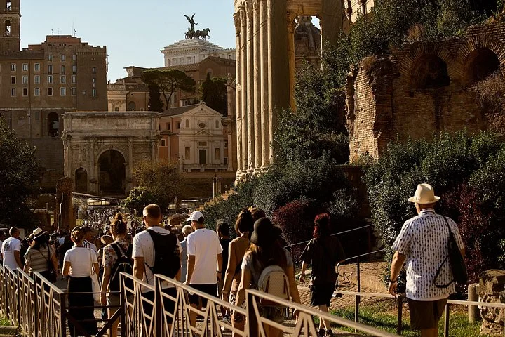 Visitors walking beside Forum temples