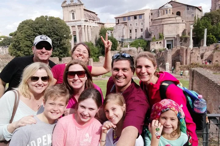 Families posing among Roman Forum ruins