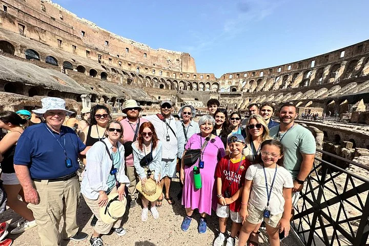 Families at a Colosseum interior viewing railing