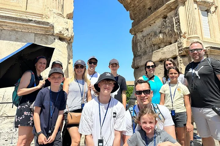 Visitors beneath a Roman Forum temple doorway