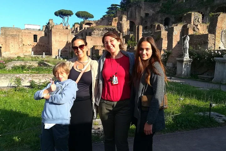 A guide and family among Forum ruins