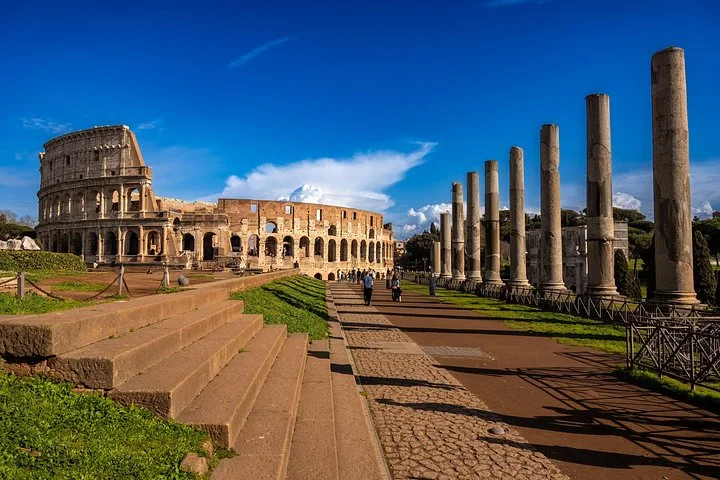 Ancient columns leading toward the Colosseum