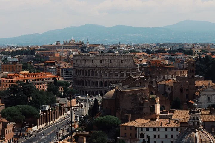 The Colosseum amid Rome’s rooftops