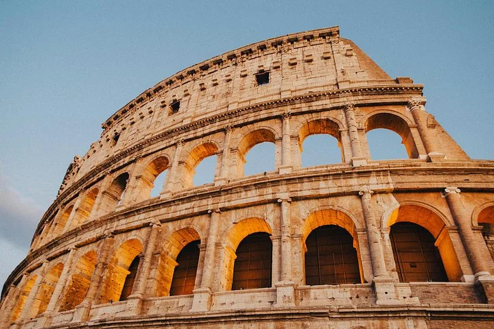 Golden light on the Colosseum’s upper arches