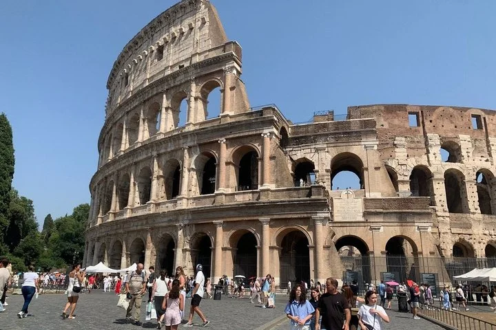 The Colosseum facade and visiting crowds