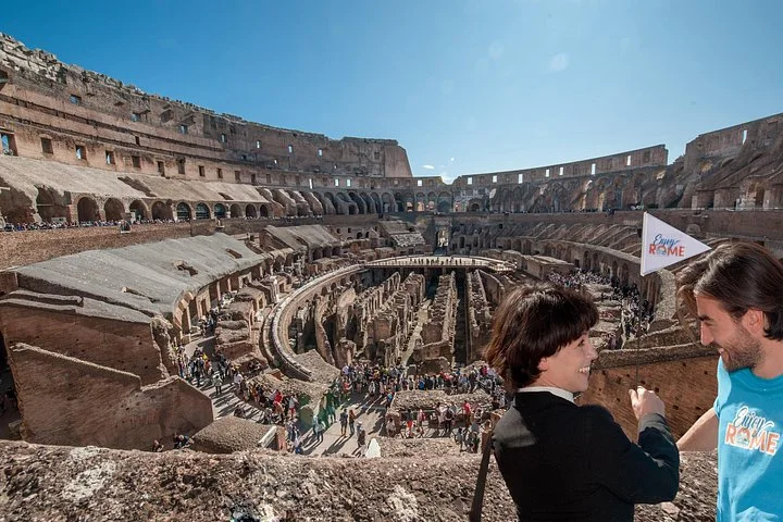 A guide and visitor above the Colosseum interior