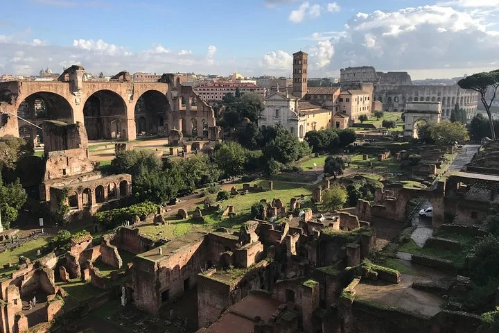 Roman Forum ruins and the Colosseum from above