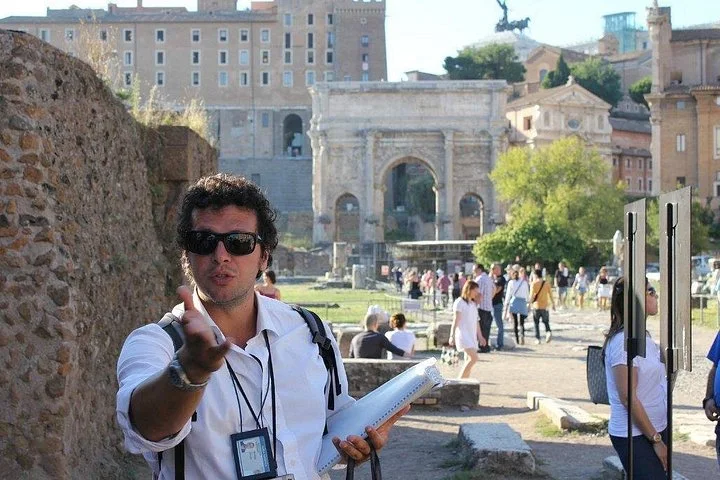 A guide speaking on a Roman Forum path