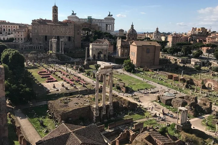 Temple ruins and Rome’s skyline from Palatine Hill
