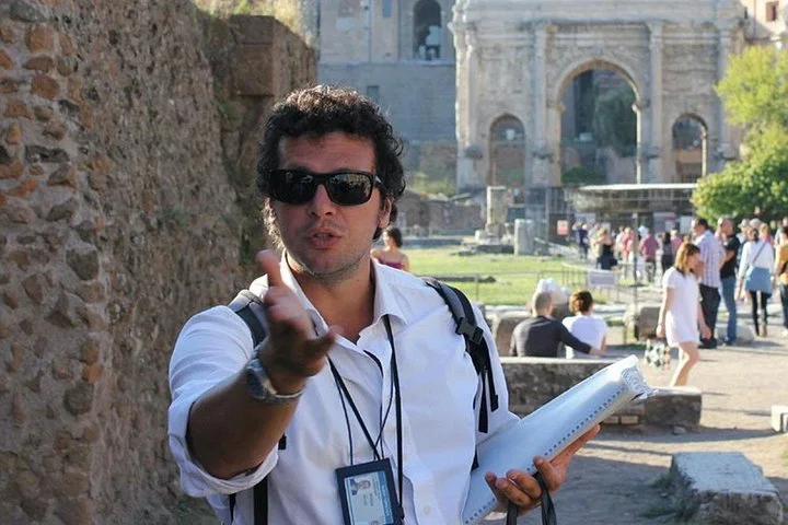 A guide speaking on a Roman Forum path