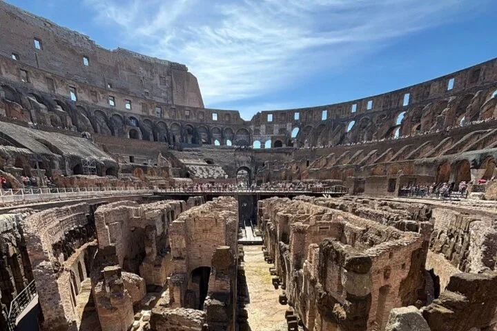 The Colosseum hypogeum viewed from above with the amphitheatre rising behind.