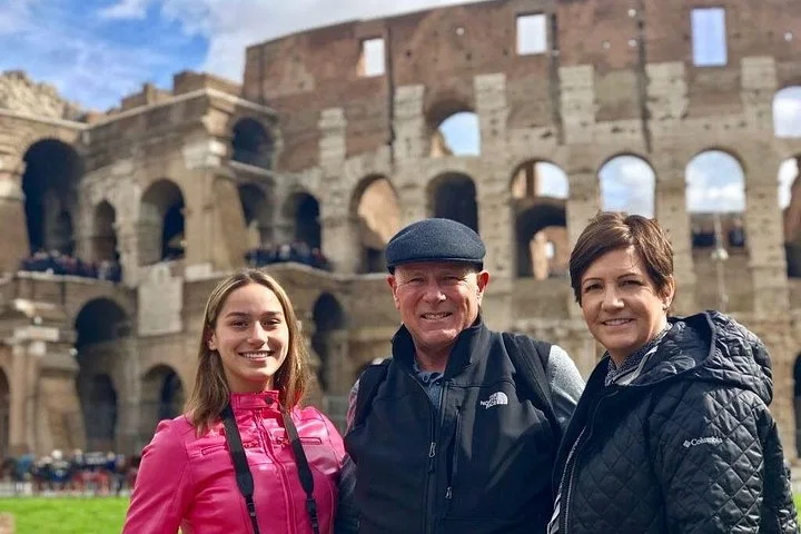 Visitors beside the Colosseum’s broken exterior wall