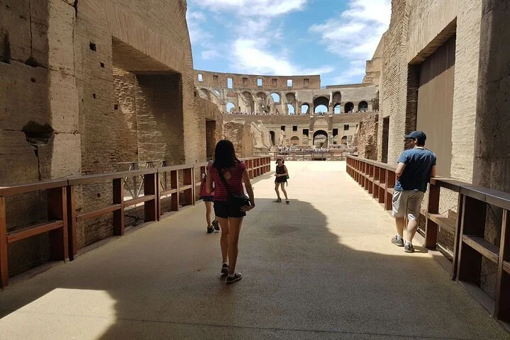 Visitors walking through the Colosseum arena entrance