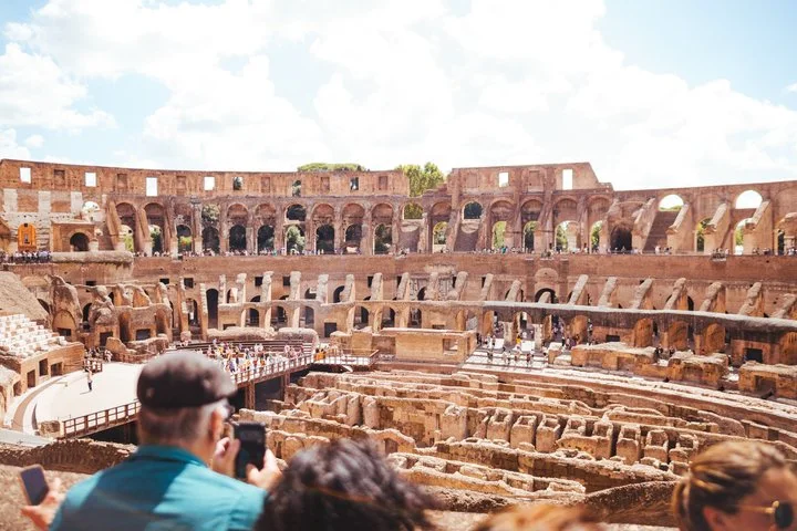 Visitors looking over the Colosseum hypogeum
