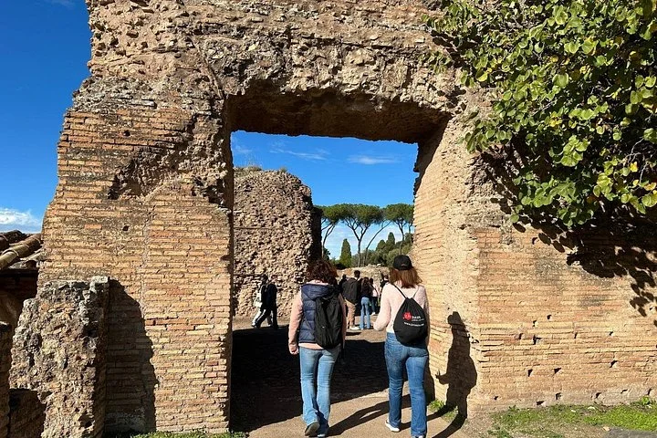 Visitors passing through an ancient Palatine doorway