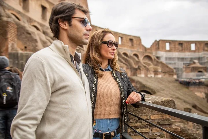 A couple looking across the Colosseum interior