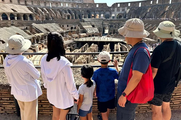 A family looking across the Colosseum interior
