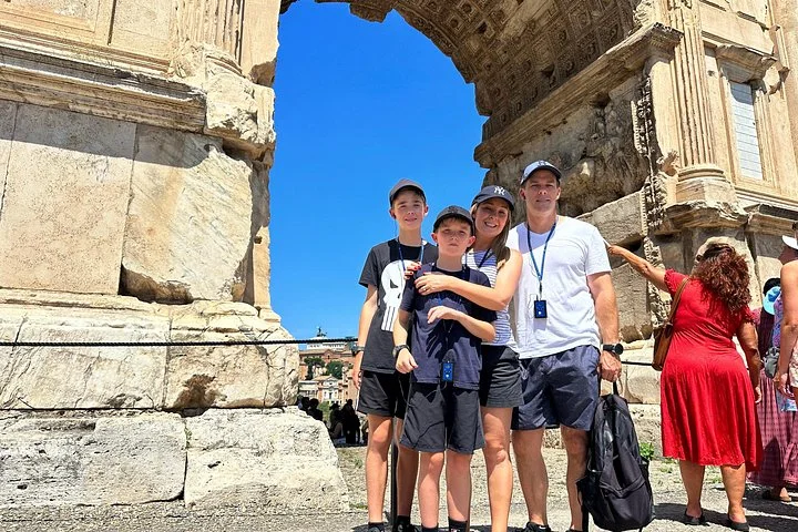 A family beside a Roman Forum temple doorway