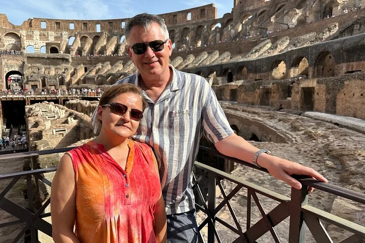 A couple at a Colosseum interior railing