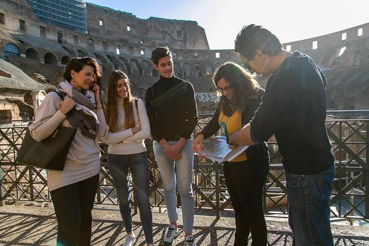 A guide showing an illustration to Colosseum visitors