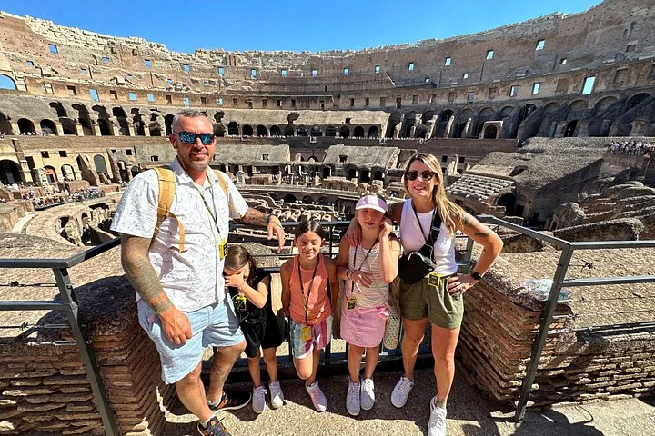 A family at the Colosseum’s interior railing