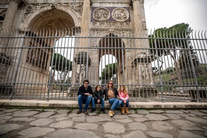 A family beside the Arch of Constantine