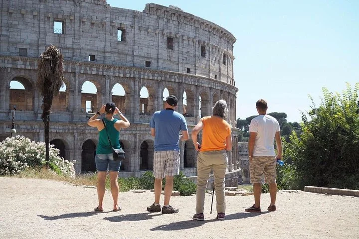 Visitors looking toward the Colosseum exterior