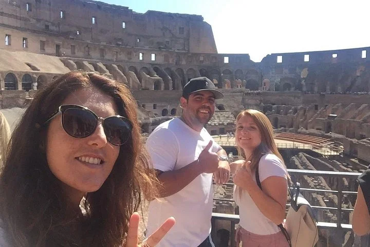 Travellers taking a selfie inside the Colosseum