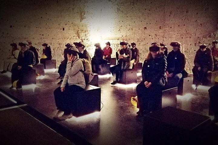 Visitors wearing virtual-reality headsets at Domus Aurea