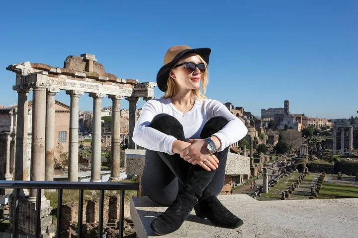 A visitor overlooking the Roman Forum temples