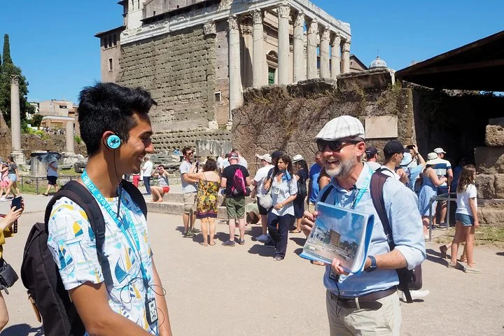 A guide and visitors on a Roman Forum path