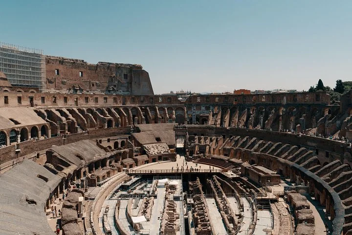 A wide view across the Colosseum arena and underground remains.