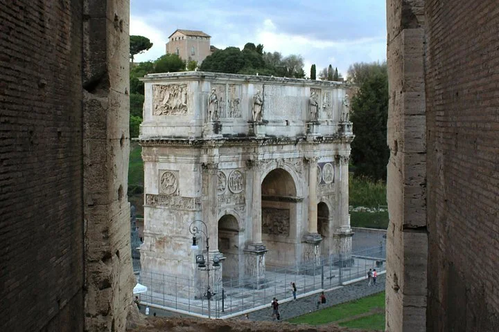 The Arch of Constantine framed by a Colosseum opening