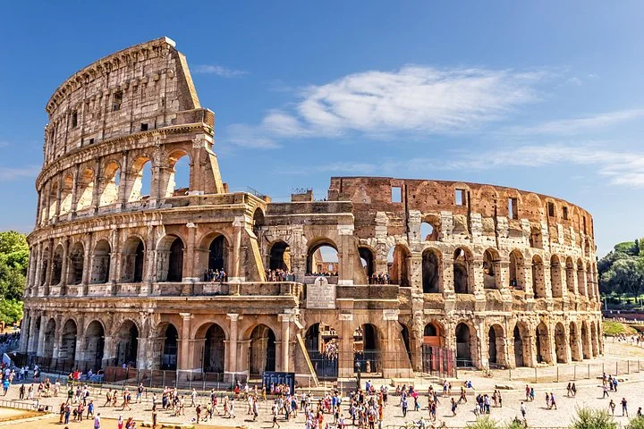 The Colosseum facade under a blue sky